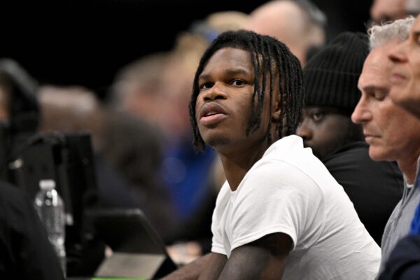 Jan 22, 2025; Dallas, Texas, USA; 2024 Heisman Trophy winner Travis Hunter Jr. looks during the first half of the game between the Dallas Mavericks and the Minnesota Timberwolves at the American Airlines Center.