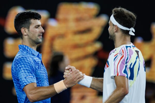 Jan 21, 2023; Melbourne, Victoria, Australia; Novak Djokovic of Serbia shakes hands with Grigor Dimitrov of Bulgaria after beating him on day six of the 2023 Australian Open tennis tournament at Melbourne Park.