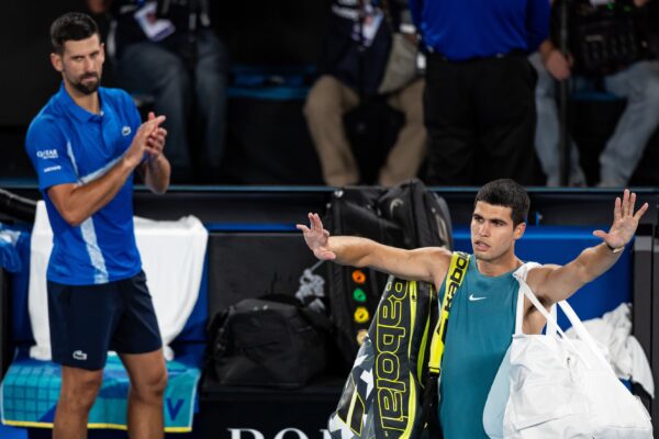 Jan 22, 2025; Melbourne, Victoria, Australia; Carlos Alcaraz of Spain gestures during his match against Novak Djokovic of Serbia in the quarterfinals of the men's singles at the 2025 Australian Open at Melbourne Park.