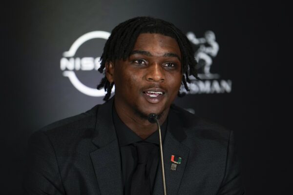 Dec 14, 2024; New York, NY, USA; Miami Hurricanes quarterback Cam Ward speaks on stage during a press conference before the 2024 Heisman Trophy Presentation.