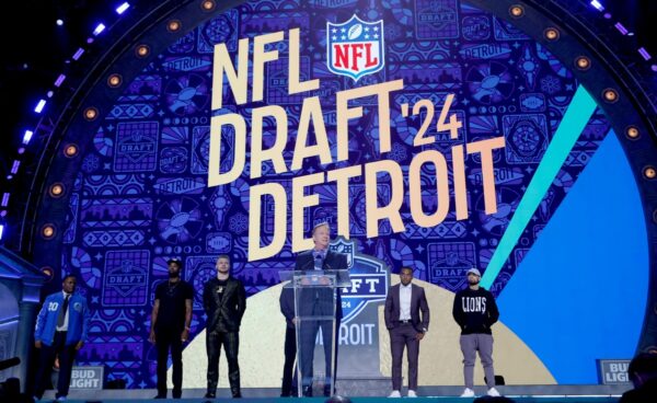Apr 25, 2024; Detroit, MI, USA; NFL commissioner Roger Goodell addresses the crowd with Eminem and Detroit Lions Jared Goff, Amon-Ra St. Brown and Aidan Hutchinson and Hall of Famers Calvin Johnson and Barry Sanders on the stage before Round 1 of the NFL draft on April 25, 2024.