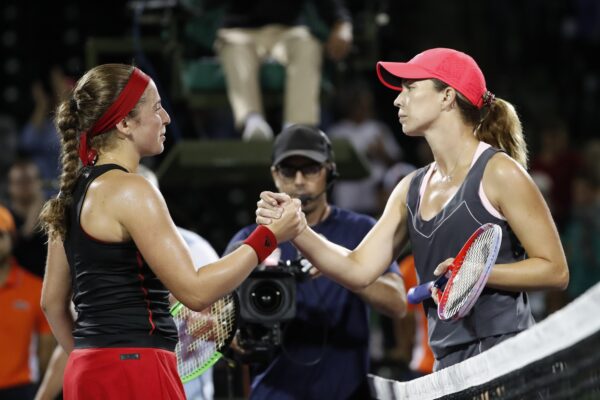 March 29, 2018; Key Biscayne, FL, USA; Jelena Ostapenko of Latvia (L) shakes hands with Danielle Collins of the United States (R) in a women's singles semi-final of the Miami Open at Tennis Center at Crandon Park. Ostapenko won 7-6(1), 6-3.