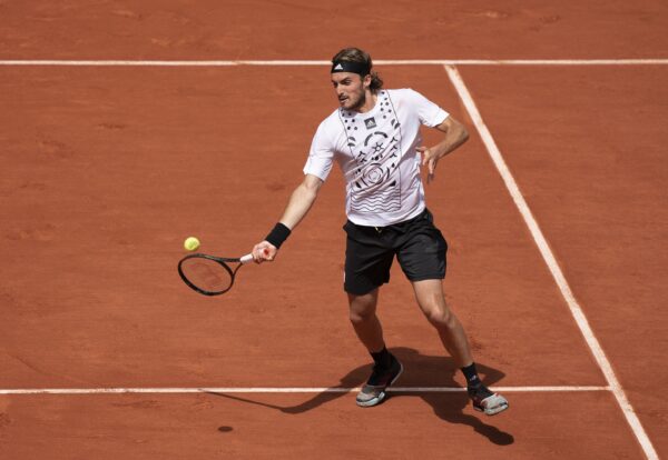 May 30, 2022; Paris, France; Stefanos Tsitsipas (GRE) returns a shot in his match against Holger Rune (DEN) on day nine of the French Open at Stade Roland-Garros.