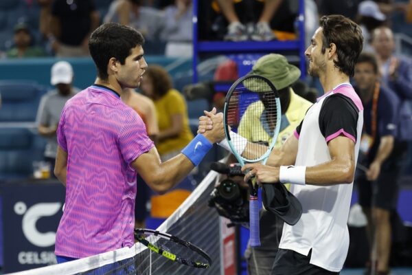Mar 26, 2024; Miami Gardens, FL, USA; Carlos Alcaraz (ESP) (L) shakes hands with Lorenzo Musetti (ITA) (R) after their match on day nine of the Miami Open at Hard Rock Stadium.