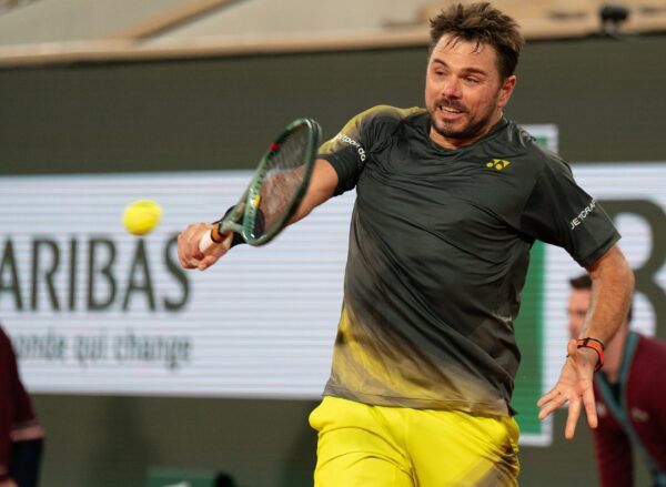 May 26, 2024; Paris, France; Stan Wawrinka of Switzerland returns a shot during his match against Andy Murray of Great Britain on day one of Roland Garros at Stade Roland Garros.