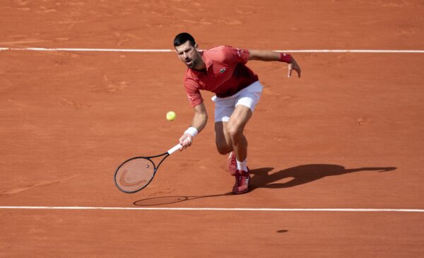 Jun 3, 2024; Paris, France; Novak Djokovic of Serbia returns a shot during his match against Francisco Cerundolo of Argentina on day nine of Roland Garros at Stade Roland Garros.