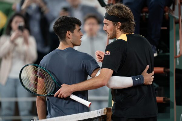 Jun 4, 2024; Paris, France; Carlos Alcaraz of Spain at the net with Stefanos Tsitsipas of Greece after their match on day 10 of Roland Garros at Stade Roland Garros.