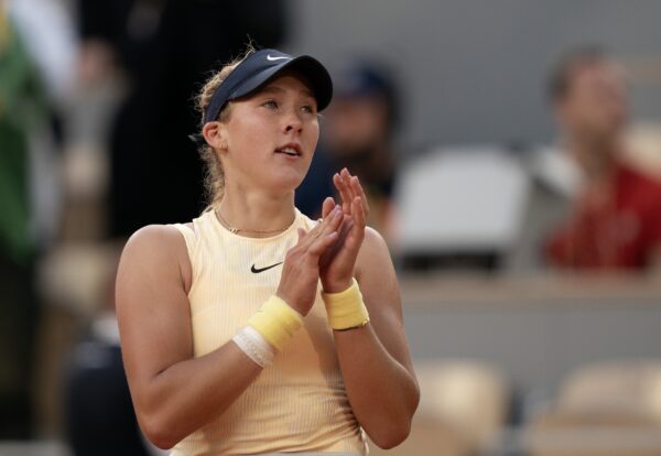 Jun 5, 2024; Paris, France; Mirra Andreeva celebrates winning her match against Aryna Sabalenka on day 11 of Roland Garros at Stade Roland Garros.