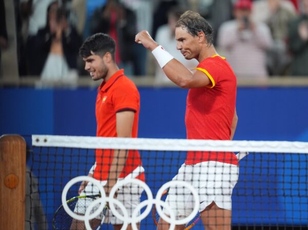Jul 27, 2024; Paris, France; Rafael Nadal (ESP) and Carlos Alcaraz (ESP) celebrate defeating Maximo Gonzalez (ARG) and Andres Molteni (ARG) in a men's tennis doubles match during the Paris 2024 Olympic Summer Games at Stade Roland Garros.