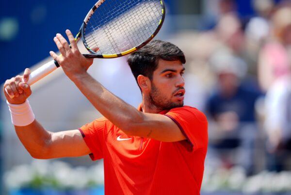 Aug 2, 2024; Paris, France; Carlos Alcaraz (ESP) returns a shot against Felix Auger-Aliassime (not pictured) during the Paris 2024 Olympic Summer Games at Stade Roland Garros.