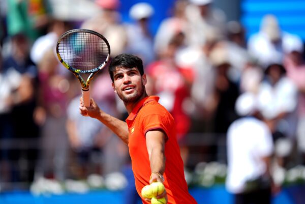 Aug 2, 2024; Paris, France; Carlos Alcaraz (ESP) celebrates after defeating Felix Auger-Aliassime (not pictured) during the Paris 2024 Olympic Summer Games at Stade Roland Garros.