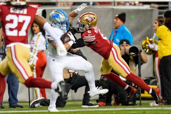 Detroit Lions running back Craig Reynolds (13) is tackled by San Francisco 49ers safety Malik Mustapha (6) during the first half at Levi's Stadium in Santa Clara, Calif. on Monday, Dec. 30, 2024.