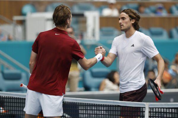 Mar 23, 2025; Miami, FL, USA; Sebastian Korda (USA)(L) shakes hands with Stefanos Tsitsipas (GRE)(R) at the net after their match on day six of the Miami Open at Hard Rock Stadium.