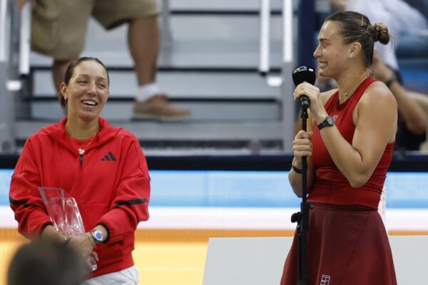 Mar 29, 2025; Miami, FL, USA; Aryna Sabalenka (R) jokes with Jessica Pegula (USA)(L) during her speech in the trophy presentation ceremony after their women's singles championship of the Miami Open at Hard Rock Stadium.