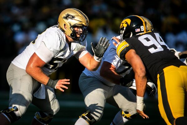 Purdue center Gus Hartwig (53) blocks against Iowa defensive lineman Yahya Black (94) during a NCAA Big Ten Conference football game, Saturday, Oct. 16, 2021, at Kinnick Stadium in Iowa City, Iowa.