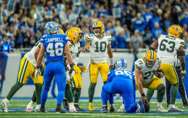 Green Bay Packers quarterback Jordan Love (10) tries to yell out the play over the roar of the crowd at the line, during the Thursday Night Football at Ford Field in Detroit on Thursday, Dec. 5, 2024.