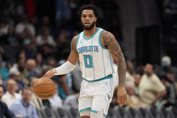 Charlotte Hornets forward Miles Bridges (0) brings the ball up court against the Utah Jazz during the first quarter at Spectrum Center.