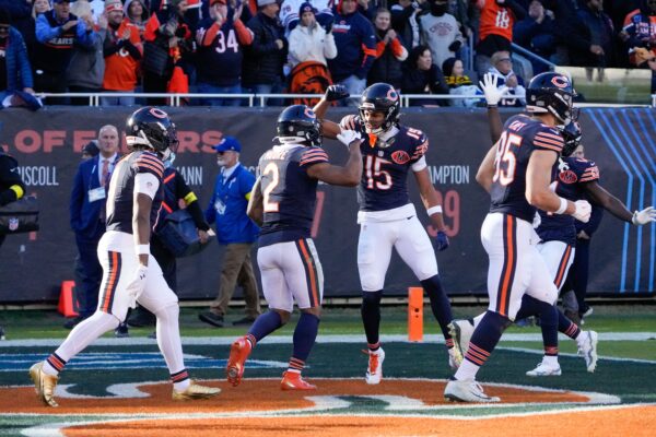 Chicago Bears wide receiver DJ Moore (2) reacts with wide receiver Rome Odunze (15) after catching a touchdown against the Pittsburgh Steelers during the second half at Soldier Field.