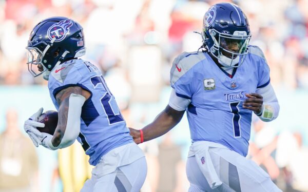 Tennessee Titans quarterback Cam Ward (1) hands off to running back Tony Pollard (20) during the fourth quarter against the Houston Texans at Nissan Stadium in Nashville, Tenn.