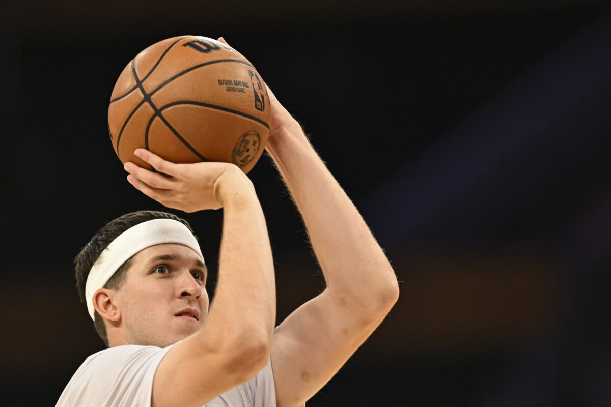 Los Angeles Lakers guard Austin Reaves (15) shoots before the game against the Miami Heat at Crypto.com Arena.