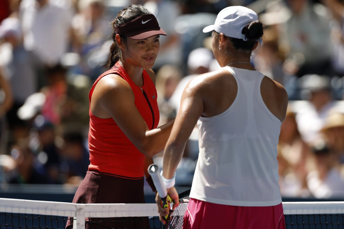 Aug 27, 2025; Flushing, NY, USA; Emma Raducanu (GBR) shakes hands with Janice Tjen (INA) (R) at the net after their match on day four of the 2025 US Open tennis tournament at Billie Jean King USTA National Tennis Center.