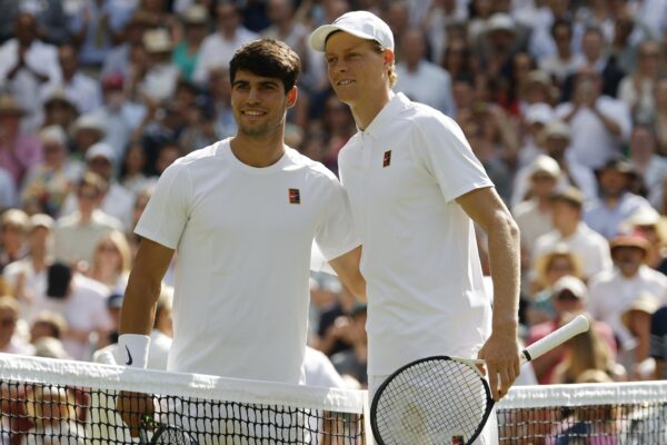 Jul 13, 2025; Wimbledon, United Kingdom; Carlos Alcaraz (ESP)(L) and Jannik Sinner (ITA)(R) pose for a picture prior to their gentlemen's' singles final of The Championships Wimbledon 2025 at All England Lawn Tennis and Croquet Club.