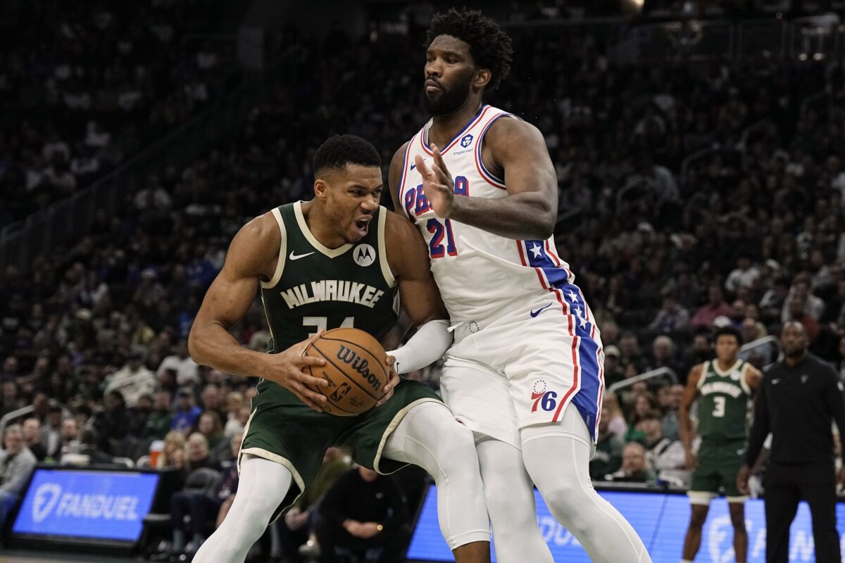 Milwaukee Bucks forward Giannis Antetokounmpo (34) looks to shoot agasint Philadelphia 76ers center Joel Embiid (21) during the second quarter at Fiserv Forum.