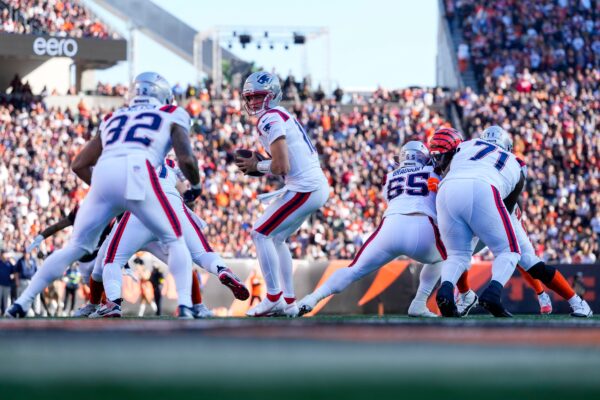 New England Patriots quarterback Drake Maye (10) drops back with the ball in the second quarter of the NFL Week 12 game between the Cincinnati Bengals and the New England Patriots at Paycor Stadium in downtown Cincinnati.