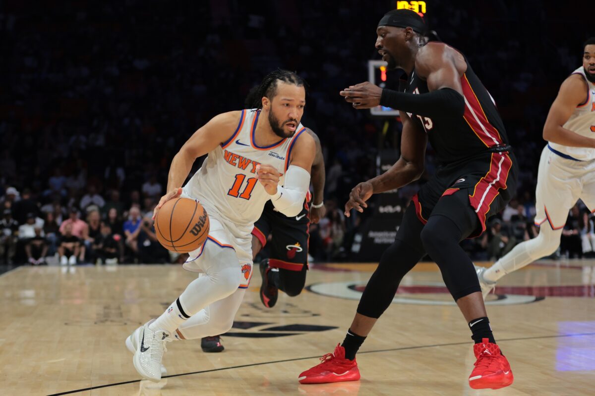 New York Knicks guard Jalen Brunson (11) drives to the basket against Miami Heat center Bam Adebayo (13) during the first quarter at Kaseya Center.