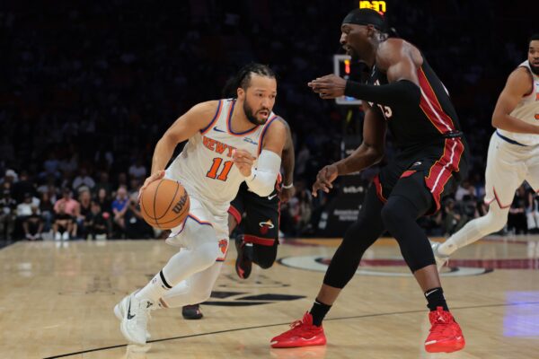 New York Knicks guard Jalen Brunson (11) drives to the basket against Miami Heat center Bam Adebayo (13) during the first quarter at Kaseya Center.