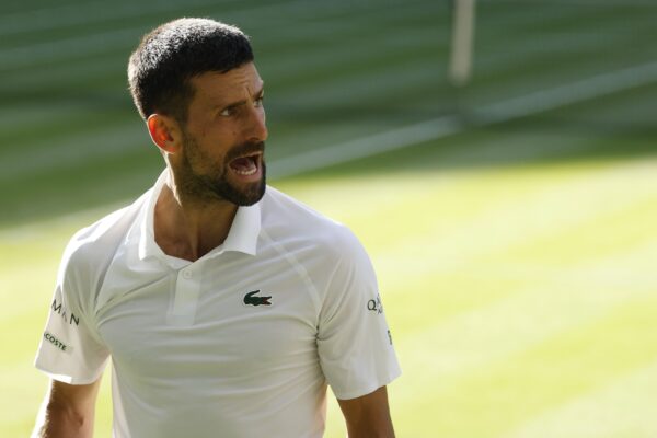 Jul 9, 2025; Wimbledon, United Kingdom; Novak Djokovic (SRB) reacts towards his player's box after losing a point against Flavio Cobolli (ITA)(not pictured) in a gentlemen's singles quarter-final on day ten of these Championships Wimbledon 2025 at All England Lawn Tennis and Croquet Club.