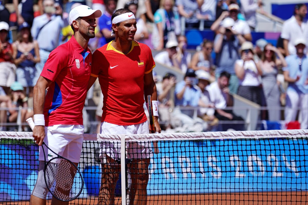Jul 29, 2024; Paris, France; Novak Djokovic (SRB) plays against Rafael Nadal (ESP) in the men’s tennis singles second round during the Paris 2024 Olympic Summer Games at Stade Roland Garros.