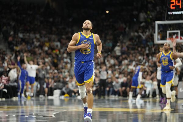 Golden State Warriors guard Stephen Curry (30) gets back on defense after scoring a three-point basket during the second half against the San Antonio Spurs at Frost Bank Center.
