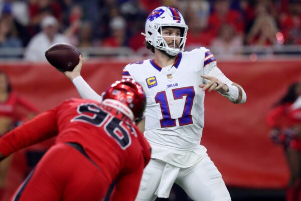 Buffalo Bills quarterback Josh Allen (17) throws a pass against Houston Texans defensive end Denico Autry (96) in the second quarter at NRG Stadium.