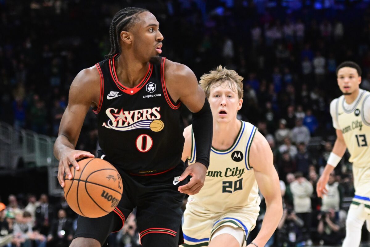 Philadelphia 76ers guard Tyrese Maxey (0) looks for a shot against Milwaukee Bucks guard AJ Green (20) in the first overtime at Fiserv Forum.