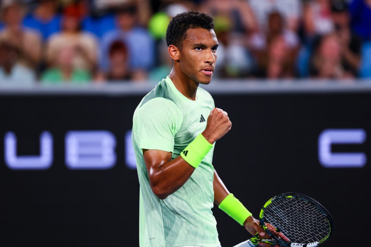 Jan 15, 2024; Melbourne, Victoria, Australia; Felix Auger Aliassime of Canada wins a point against Dominic Thiem (not pictured) of Austria in Round 1 of the Men's Singles on Day 2 of the Australian Open tennis at Rod Laver Arena.