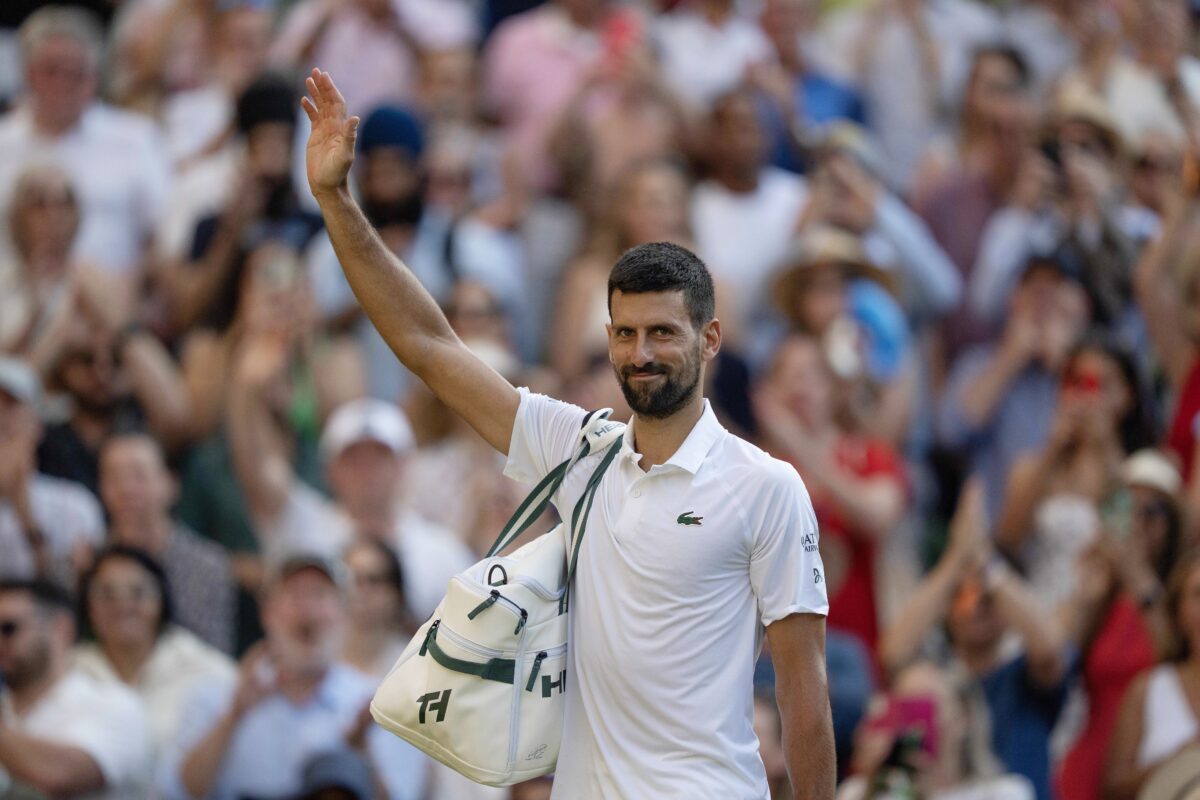 Jul 11, 2025; Wimbledon, United Kingdom; Novak Djokovic of Serbia leaves the court after losing his match to Jannik Sinner of Italy after their match on day 12 at All England Lawn Tennis and Croquet Club.