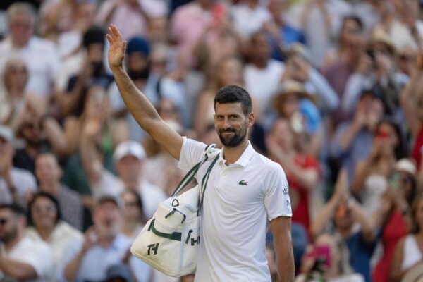 Jul 11, 2025; Wimbledon, United Kingdom; Novak Djokovic of Serbia leaves the court after losing his match to Jannik Sinner of Italy after their match on day 12 at All England Lawn Tennis and Croquet Club.