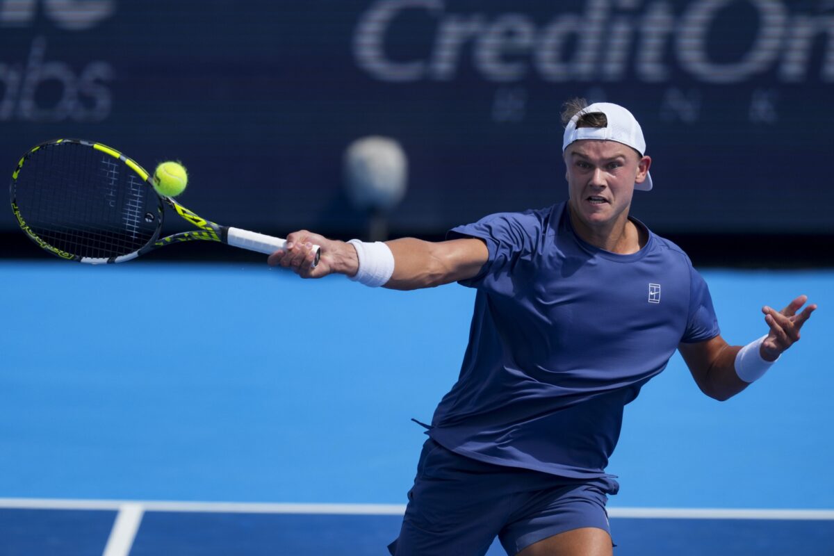 Aug 13, 2025; Cincinnati, OH, USA; Holger Rune (DEN) returns a shot against Frances Tiafoe (USA) during the Cincinnati Open at the Lindner Family Tennis Center.