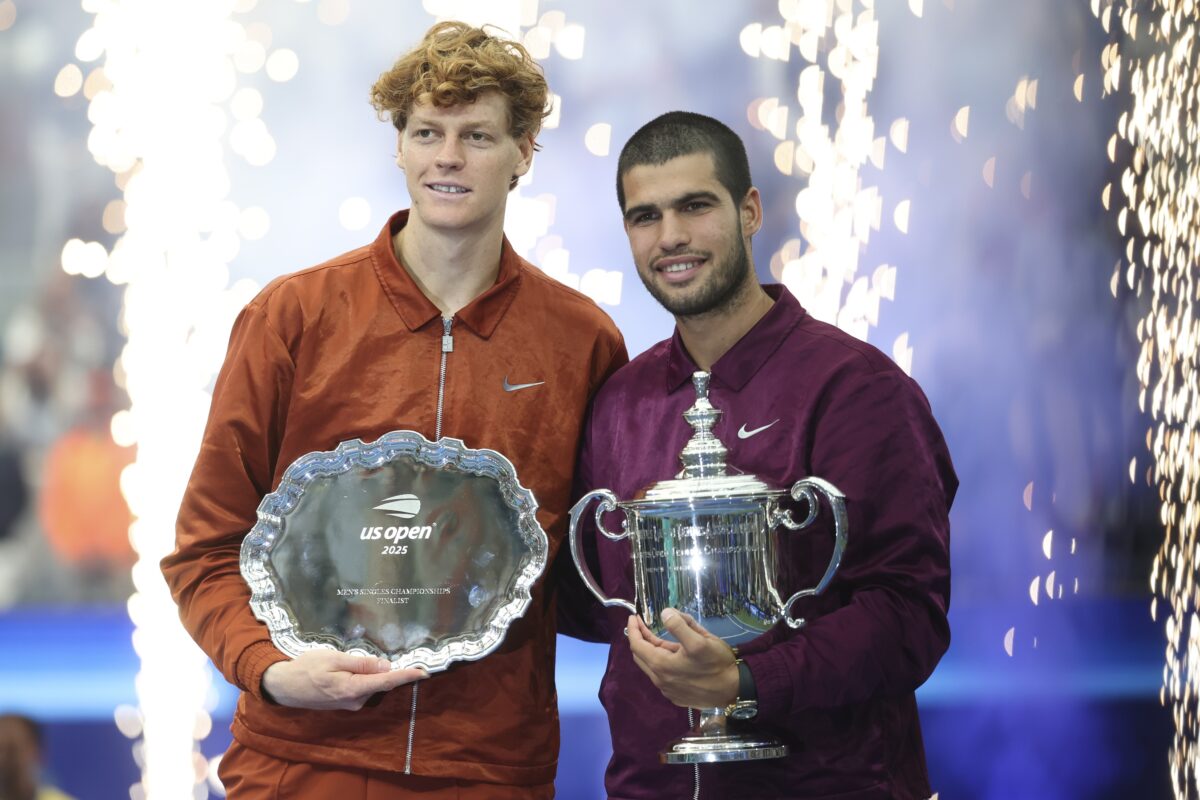 Sep 7, 2025; Flushing, NY, USA; Carlos Alcaraz (ESP) and Jannik Sinner (ITA) pose with their trophies after the final of mens singles at Billie Jean King National Tennis Center.