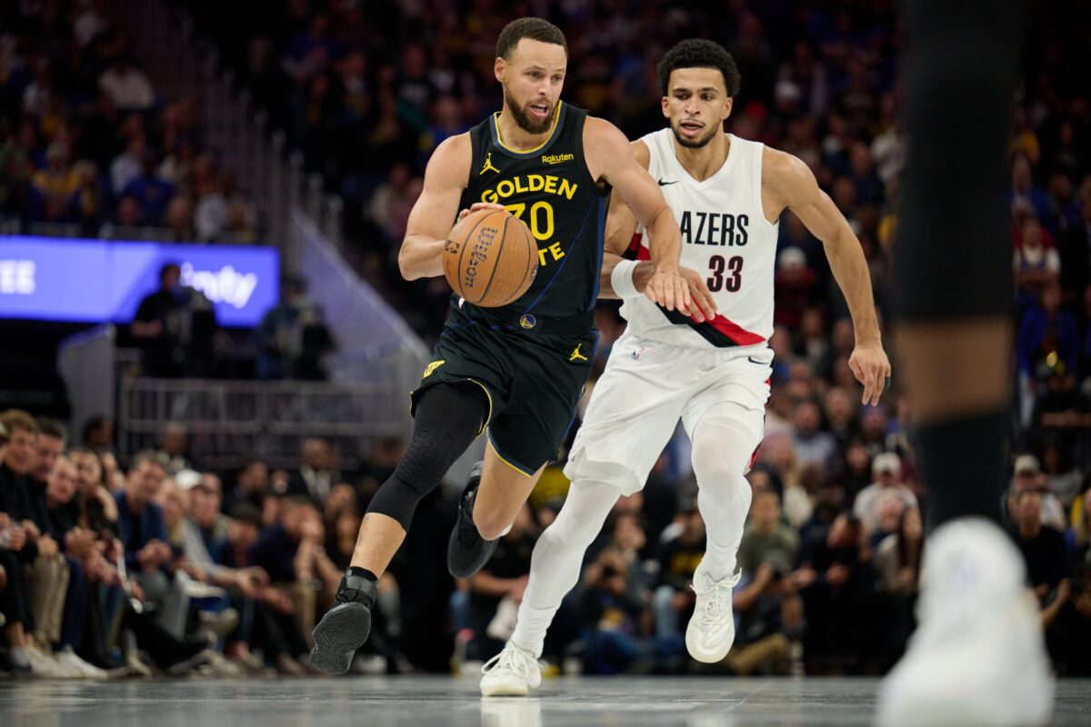 Golden State Warriors guard Stephen Curry (30) drives to the basket wearing Li Ning Jimmy Butler 4 (JB4) Black Knight shoes against Portland Trail Blazers forward Toumani Camara (33) during the fourth quarter at Chase Center.
