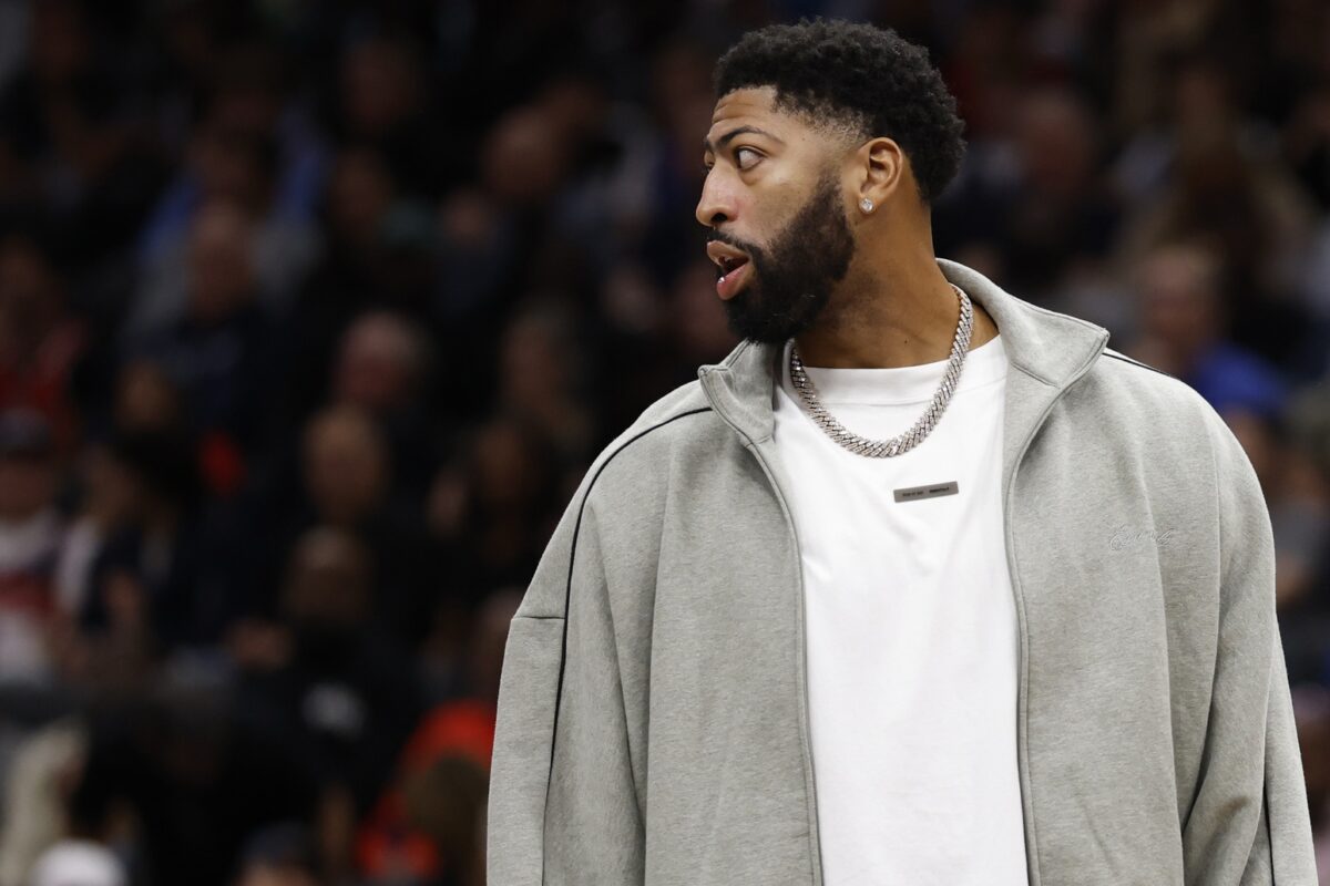 Injured Dallas Mavericks forward Anthony Davis looks on from the bench during a timeout against the Washington Wizards in the second half at Capital One Arena.