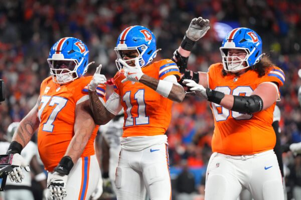 Denver Broncos wide receiver Troy Franklin (11) reacts after a touchdown during the first half at Empower Field at Mile High.