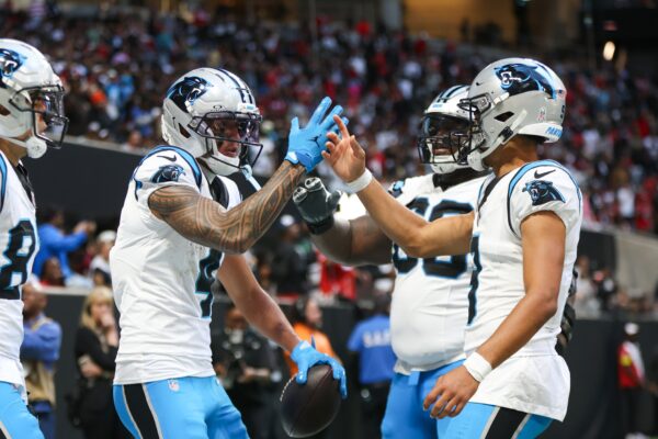 Carolina Panthers quarterback Bryce Young (9) shakes hands with wide receiver Tetairoa McMillan (4) after a touchdown in the fourth quarter against the Atlanta Falcons at Mercedes-Benz Stadium.