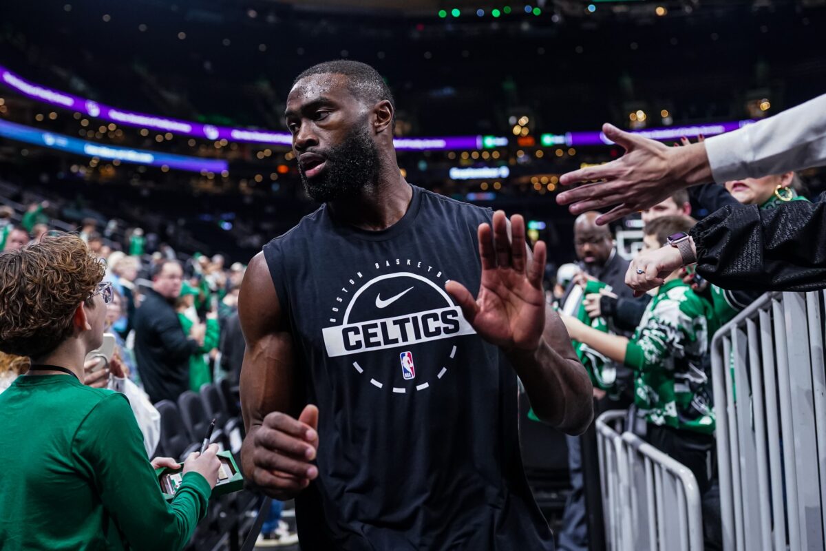 Boston Celtics guard Jaylen Brown (7) comes off then court after warm up before the start of the game against the Miami Heat at TD Garden.