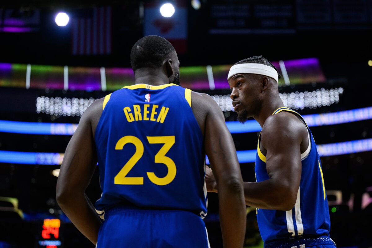 Golden State Warriors forward Jimmy Butler III (10) talks to forward Draymond Green (23) during the first half against the Los Angeles Lakers at Crypto.com Arena.