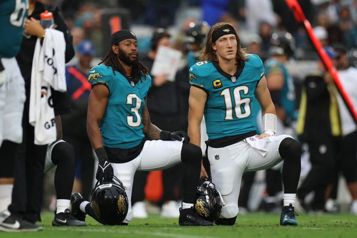 Jacksonville Jaguars wide receiver Jakobi Meyers (3) and quarterback Trevor Lawrence (16) take a knee during an injury time out in the first half against the Indianapolis Colts at EverBank Stadium.
