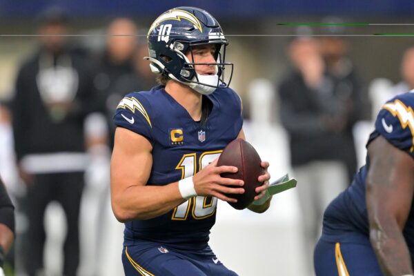 Los Angeles Chargers quarterback Justin Herbert (10) drops back to pass against the Las Vegas Raiders during the first half at SoFi Stadium.