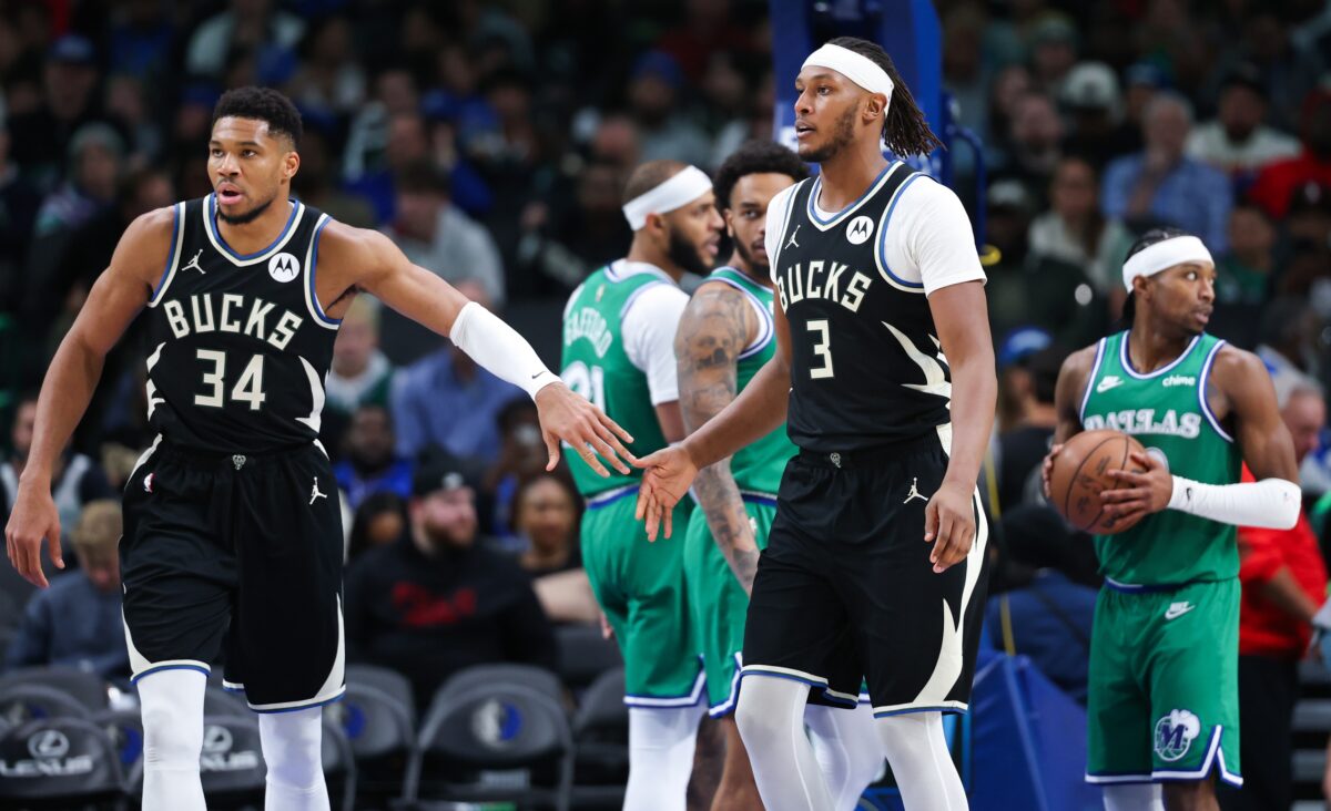 Milwaukee Bucks forward Giannis Antetokounmpo (34) celebrates with Milwaukee Bucks center Myles Turner (3) during the third quarter against the Dallas Mavericks at American Airlines Center.