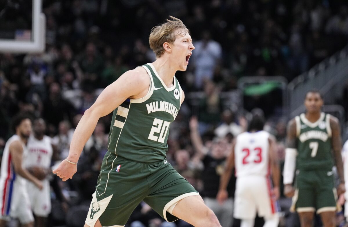 Milwaukee Bucks guard AJ Green (20) yells out during a time out after a made three point shot against the Detroit Pistons at Fiserv Forum.